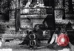 Image of Man sings and plays a saranqi at a temple India, 1953, second 19 stock footage video 65675028606