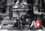 Image of Man sings and plays a saranqi at a temple India, 1953, second 24 stock footage video 65675028606