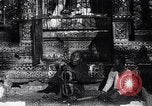 Image of Man sings and plays a saranqi at a temple India, 1953, second 26 stock footage video 65675028606
