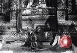 Image of Man sings and plays a saranqi at a temple India, 1953, second 27 stock footage video 65675028606