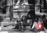 Image of Man sings and plays a saranqi at a temple India, 1953, second 29 stock footage video 65675028606