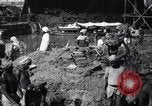 Image of Men digging clay from a river bank India, 1953, second 1 stock footage video 65675028607
