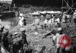 Image of Men digging clay from a river bank India, 1953, second 3 stock footage video 65675028607