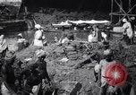 Image of Men digging clay from a river bank India, 1953, second 4 stock footage video 65675028607