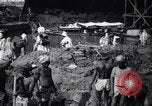 Image of Men digging clay from a river bank India, 1953, second 5 stock footage video 65675028607