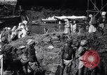 Image of Men digging clay from a river bank India, 1953, second 9 stock footage video 65675028607