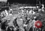 Image of Men digging clay from a river bank India, 1953, second 10 stock footage video 65675028607