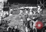 Image of Men digging clay from a river bank India, 1953, second 11 stock footage video 65675028607