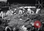 Image of Men digging clay from a river bank India, 1953, second 13 stock footage video 65675028607