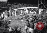 Image of Men digging clay from a river bank India, 1953, second 14 stock footage video 65675028607