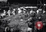 Image of Men digging clay from a river bank India, 1953, second 15 stock footage video 65675028607