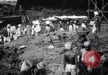 Image of Men digging clay from a river bank India, 1953, second 16 stock footage video 65675028607