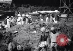 Image of Men digging clay from a river bank India, 1953, second 17 stock footage video 65675028607