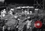 Image of Men digging clay from a river bank India, 1953, second 18 stock footage video 65675028607