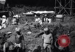 Image of Men digging clay from a river bank India, 1953, second 19 stock footage video 65675028607