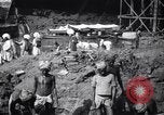 Image of Men digging clay from a river bank India, 1953, second 20 stock footage video 65675028607