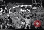Image of Men digging clay from a river bank India, 1953, second 21 stock footage video 65675028607