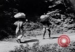 Image of Hindu pilgrims journeying to the soutce of the Ganges River India, 1939, second 25 stock footage video 65675028616