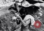 Image of Hindu pilgrims bathe while on journey to Ganges river source India, 1939, second 13 stock footage video 65675028617
