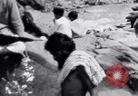 Image of Hindu pilgrims bathe while on journey to Ganges river source India, 1939, second 18 stock footage video 65675028617