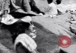 Image of Hindu pilgrims bathe while on journey to Ganges river source India, 1939, second 19 stock footage video 65675028617