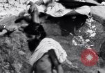 Image of Hindu pilgrims bathe while on journey to Ganges river source India, 1939, second 21 stock footage video 65675028617
