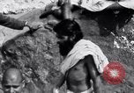 Image of Hindu pilgrims bathe while on journey to Ganges river source India, 1939, second 22 stock footage video 65675028617