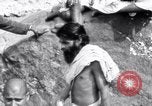 Image of Hindu pilgrims bathe while on journey to Ganges river source India, 1939, second 23 stock footage video 65675028617