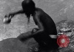 Image of Hindu pilgrims bathe while on journey to Ganges river source India, 1939, second 24 stock footage video 65675028617