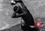 Image of Hindu pilgrims bathe while on journey to Ganges river source India, 1939, second 28 stock footage video 65675028617
