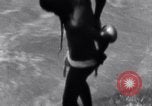 Image of Hindu pilgrims bathe while on journey to Ganges river source India, 1939, second 32 stock footage video 65675028617