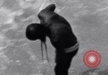 Image of Hindu pilgrims bathe while on journey to Ganges river source India, 1939, second 33 stock footage video 65675028617