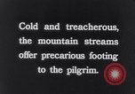 Image of Hindu pilgrims bathe while on journey to Ganges river source India, 1939, second 36 stock footage video 65675028617