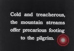 Image of Hindu pilgrims bathe while on journey to Ganges river source India, 1939, second 37 stock footage video 65675028617