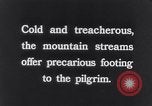 Image of Hindu pilgrims bathe while on journey to Ganges river source India, 1939, second 41 stock footage video 65675028617