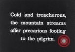 Image of Hindu pilgrims bathe while on journey to Ganges river source India, 1939, second 43 stock footage video 65675028617