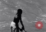Image of Hindu pilgrims bathe while on journey to Ganges river source India, 1939, second 44 stock footage video 65675028617