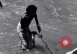 Image of Hindu pilgrims bathe while on journey to Ganges river source India, 1939, second 46 stock footage video 65675028617