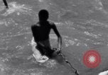 Image of Hindu pilgrims bathe while on journey to Ganges river source India, 1939, second 47 stock footage video 65675028617