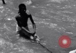 Image of Hindu pilgrims bathe while on journey to Ganges river source India, 1939, second 48 stock footage video 65675028617