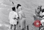 Image of Hindu pilgrims bathe while on journey to Ganges river source India, 1939, second 53 stock footage video 65675028617