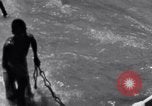 Image of Hindu pilgrims bathe while on journey to Ganges river source India, 1939, second 58 stock footage video 65675028617