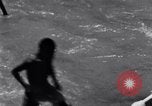 Image of Hindu pilgrims bathe while on journey to Ganges river source India, 1939, second 59 stock footage video 65675028617