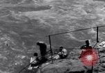 Image of Hindu pilgrims bathe while on journey to Ganges river source India, 1939, second 61 stock footage video 65675028617
