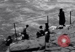 Image of Hindu pilgrims bathe while on journey to Ganges river source India, 1939, second 62 stock footage video 65675028617