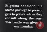Image of Hindu pilgrims giving gifts to priests during their pilgrimage India, 1939, second 4 stock footage video 65675028618