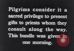 Image of Hindu pilgrims giving gifts to priests during their pilgrimage India, 1939, second 6 stock footage video 65675028618