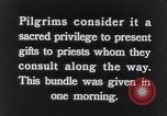 Image of Hindu pilgrims giving gifts to priests during their pilgrimage India, 1939, second 7 stock footage video 65675028618