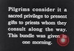 Image of Hindu pilgrims giving gifts to priests during their pilgrimage India, 1939, second 9 stock footage video 65675028618