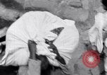 Image of Hindu pilgrims giving gifts to priests during their pilgrimage India, 1939, second 19 stock footage video 65675028618